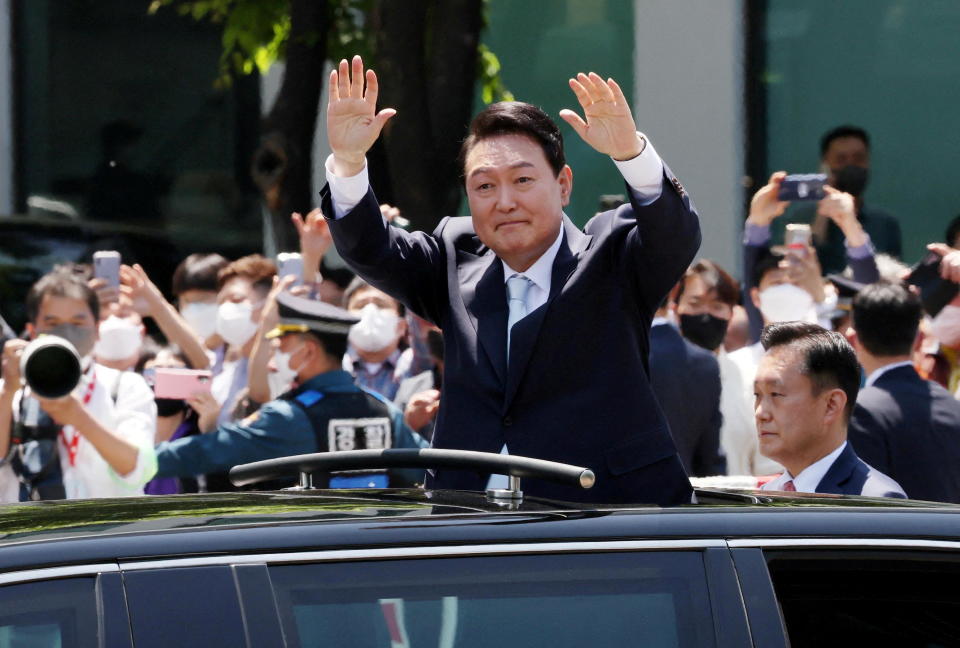 South Korea's new President Yoon Suk Yeol waves to supporters while leaving his inauguration ceremony at the National Assembly in Seoul, South Korea, May 10, 2022. / Credit: YONHAP NEWS AGENCY/REUTERS