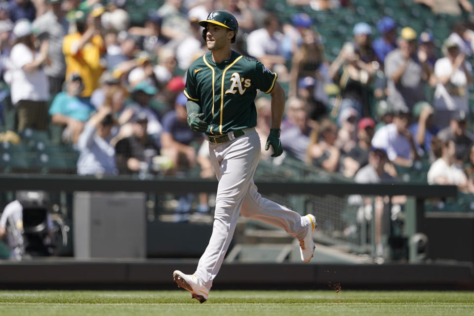 Oakland Athletics' Matt Olson rounds the bases after he hit a solo home run during the third inning of a baseball game against the Seattle Mariners, Sunday, July 25, 2021, in Seattle. (AP Photo/Ted S. Warren)