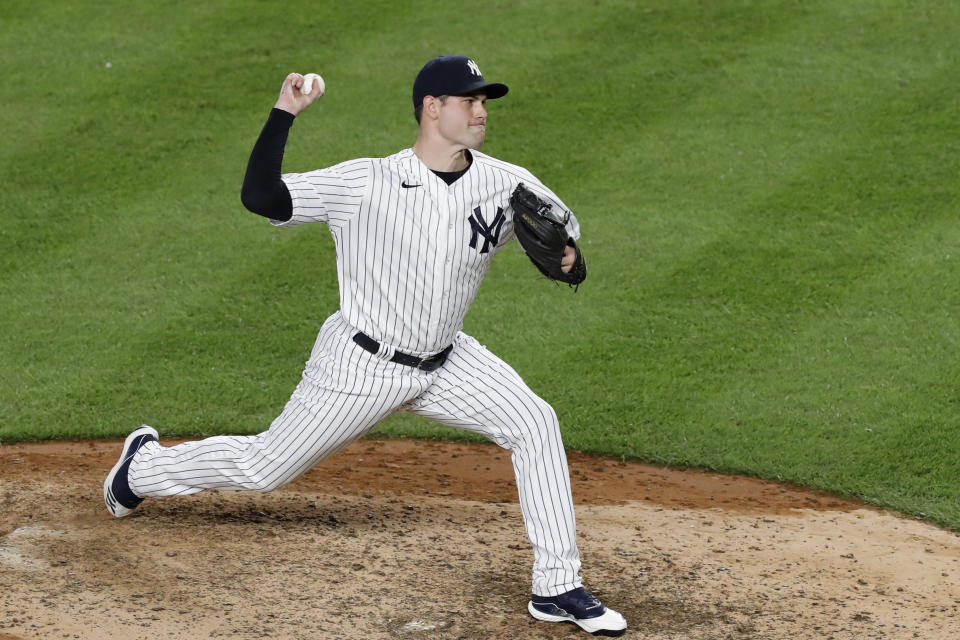 New York Yankees relief pitcher Adam Ottavino winds up during the eighth inning of the team's baseball game against the Boston Red Sox, Sunday, Aug. 2, 2020, at Yankee Stadium in New York. (AP Photo/Kathy Willens)
