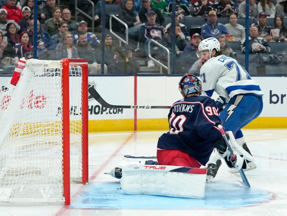 Feb. 10, 2024; Columbus, Ohio, USA; 
Tampa Bay Lightning center Anthony Cirelli (71) scores a goal past Columbus Blue Jackets goaltender Elvis Merzlikins (90) during the second period of a hockey game at Nationwide Arena on Saturday.