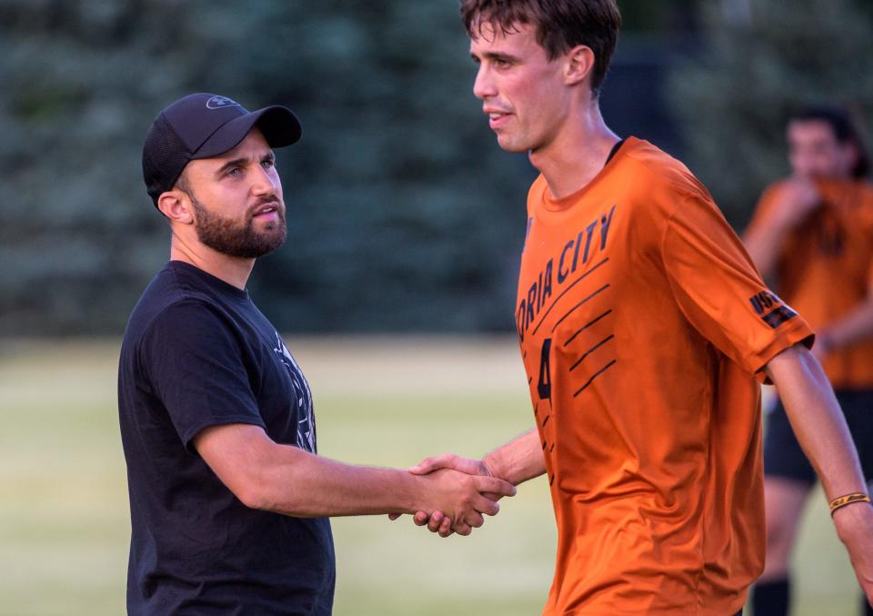 Peoria City head coach Ruben Resendes, left, talks with Jordi Ramon after the first period of their USL2 match against Minneapolis on Saturday, May 14, 2022 at Shea Stadium in Peoria.