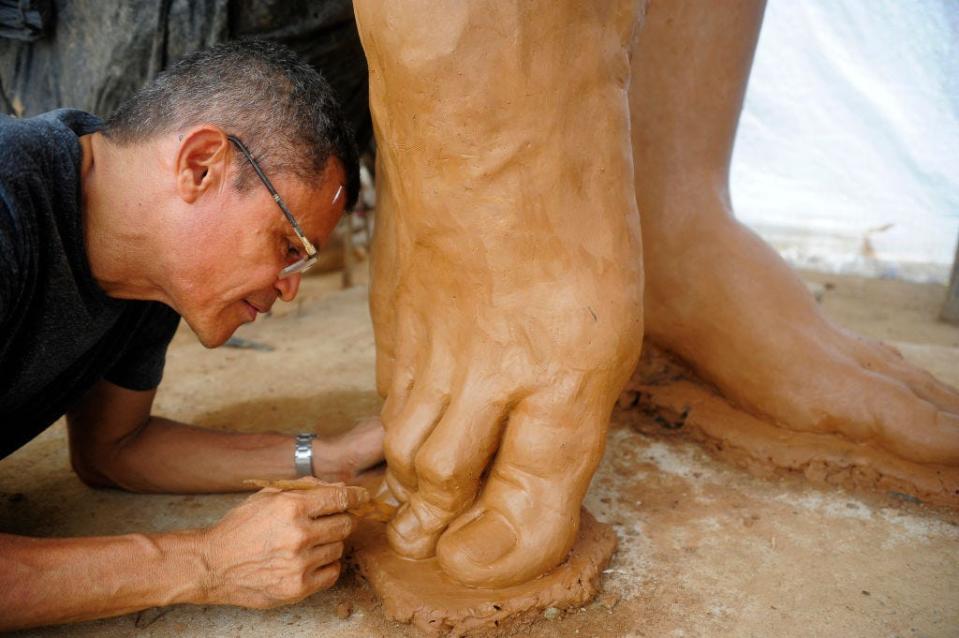 icture taken on August 25, 2023, of Colombian artist Yino Marquez working in a statue of Colombian singer Shakira in Barranquilla, Colombia. Colombian superstar Shakira's Caribbean home city of Barranquilla unveiled a 6.5-meter (21.3-foot) hip-swaying statue in her honor on Tuesday.