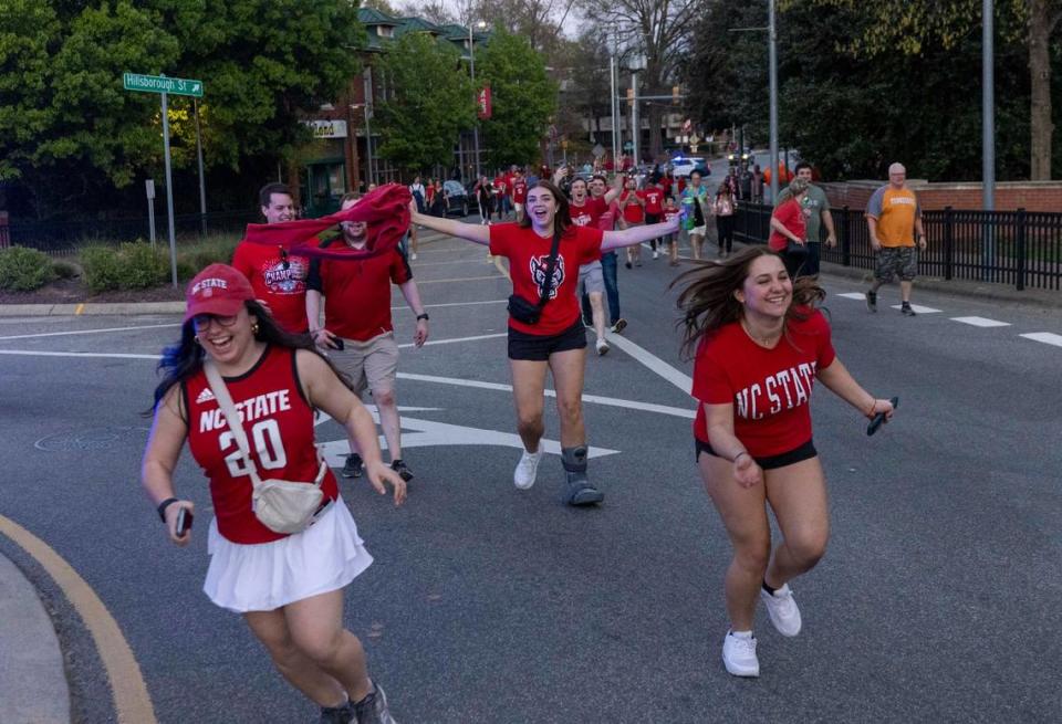 NC State fans run on Hillsborough Street after the men’s basketball team’s 76-64 win over Duke to advance to the Final Four in the NCAA Men’s Division I Basketball Tournament on Sunday, March 31, 2024.