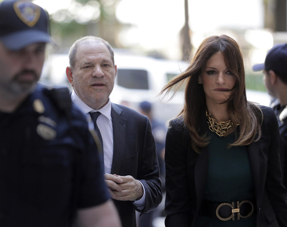 FILE - In this July 11, 2019 file photo, Harvey Weinstein, left, and attorney Donna Rotunno arrive at court for a hearing related to his sexual assault case in New York. Weinstein is set to go on trial Monday, Jan. 6, 2020 more than two years after a torrent of women began accusing him of misconduct. (AP Photo/Seth Wenig, File)