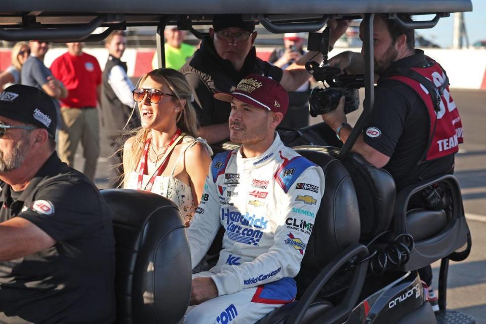 NASCAR Cup Series driver Kyle Larson, center, arrives at North Wilkesboro Speedway prior to the running of the NASCAR All-Star Race. Larson had earlier qualified fifth for the Indianapolis 500 on Sunday, May 19, 2024.