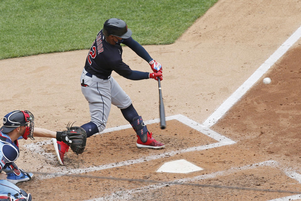 Cleveland Indians' Francisco Lindor hits an RBI single in the fourth inning of a baseball game Sunday, Aug. 2, 2020, in Minneapolis. (AP Photo/Jim Mone)