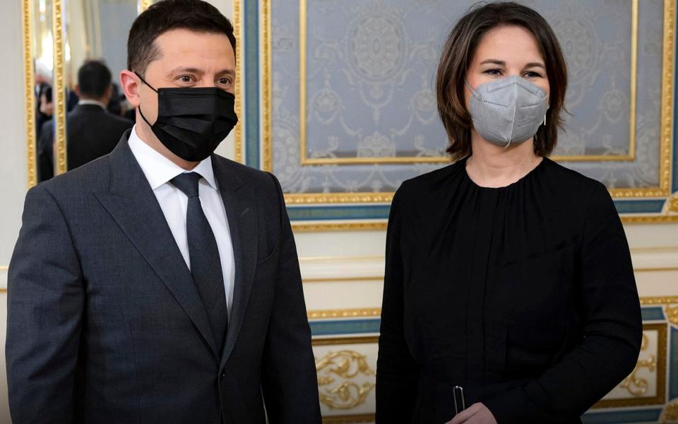 In this photo provided by Ukrainian Presidential Press Office, Ukrainian President Volodymyr Zelenskyy, left, and German Foreign Minister Annalena Baerbock pose for a photo during their meeting in Kyiv, Ukraine, Monday, Jan. 17, 2022. (Ukrainian Presidential Press Office via AP) - Ukrainian Presidential Press Office 
