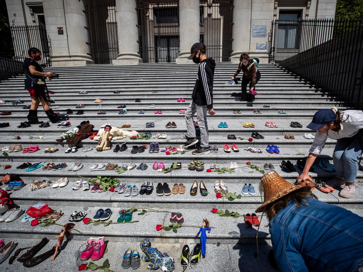 <p>More than 200 pairs of children’s shoes have been placed on the steps of the Vancouver Art Gallery to pay tribute to those buried at the school site</p> (AP)