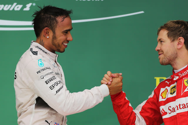 File photo dated 25-10-2015 of Mercedes' Lewis Hamilton shakes hands with Ferrari's Sebastian Vettel (right) after his victory and winning the 2015 Formula One World Championship in the United States Grand Prix at the Circuit of The Americas in Austin, Texas, USA.