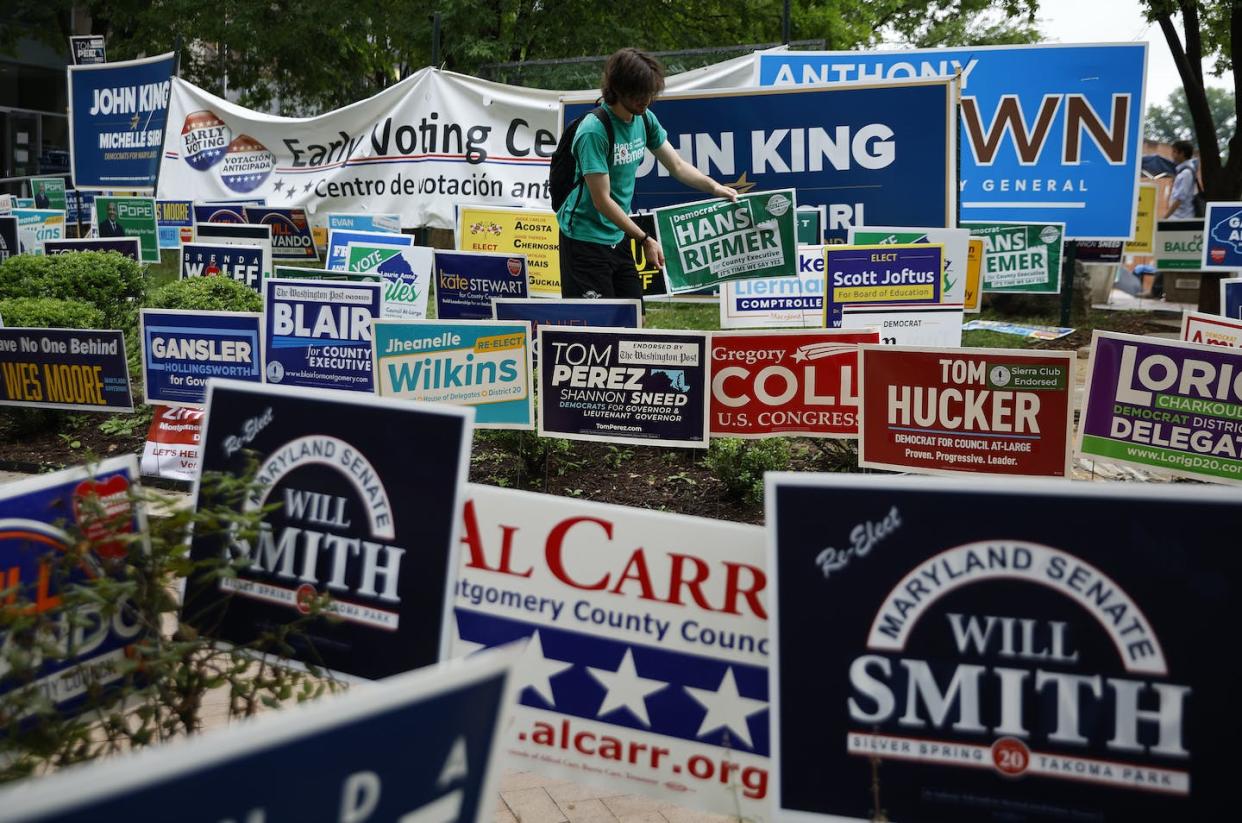 Candidate signs during the first day of early primary voting on July 7, 2022, in Silver Spring, Md. <a href="https://www.gettyimages.com/detail/news-photo/campaign-signs-compete-for-space-during-the-first-day-of-news-photo/1407345278?phrase=early%20voting%20united%20states&adppopup=true" rel="nofollow noopener" target="_blank" data-ylk="slk:Chip Somodevilla/Getty Images;elm:context_link;itc:0;sec:content-canvas" class="link ">Chip Somodevilla/Getty Images</a>