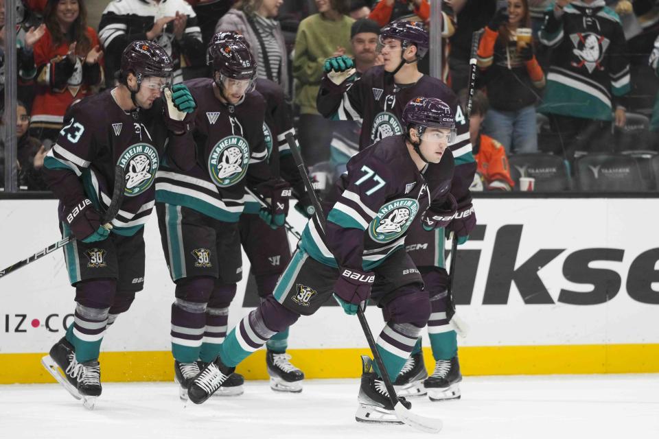 Anaheim Ducks' Frank Vatrano (77) skates toward the bench after celebrating his goal with teammates during the first period of an NHL hockey game against the San Jose Sharks Sunday, Nov. 12, 2023, in Anaheim, Calif. (AP Photo/Jae C. Hong)