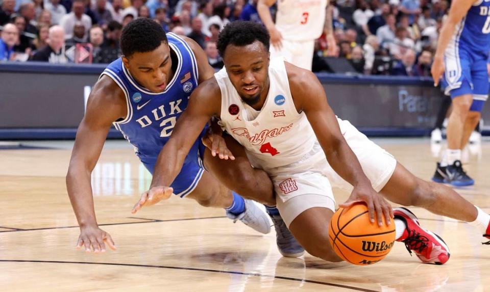 Duke’s Jaylen Blakes (2) and Houston’s L.J. Cryer (4) go for the ball during the first half of Duke’s game against Houston in their NCAA Tournament Sweet 16 game at the American Airlines Center in Dallas, Texas, Friday, March 29, 2024.