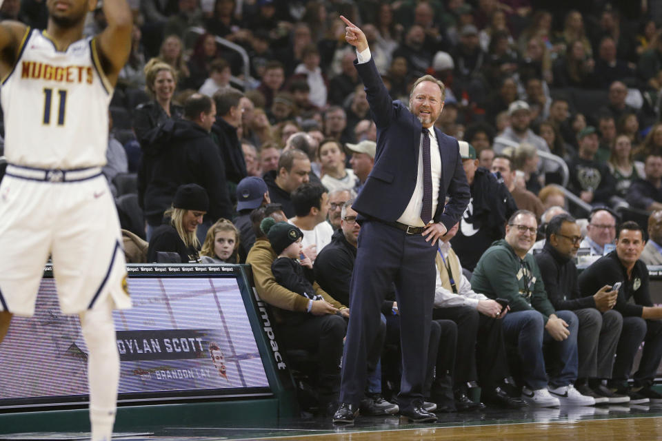 Milwaukee Bucks coach Mike Budenholzer gestures from the sideline during the first half of the team's NBA basketball game against the Denver Nuggets Friday, Jan. 31, 2020, in Milwaukee. (AP Photo/Aaron Gash)