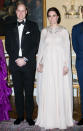 For an evening dinner held at the Royal Palace in Oslo on day three of the tour, the Duchess of Cambridge, who was pregnant with Prince Louis at the time, wore a caped Alexander McQueen gown in blush pink. <em>[Photo: Getty]</em>
