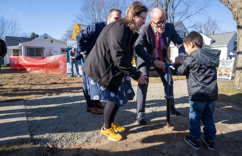 Tom Perez, an advisor to President Joe Biden, joins Wausau Mayor Katie Rosenberg and Miles Guerrero, 3, during a media event Thursday, November 9, 2023 to turn on the water at the home of Miles’ great-grandmother. The home’s old water service line was replaced with a lead-free connection in Wausau, Wisconsin. Perez was in town to highlight actions taken by President Biden’s administration for clean drinking water.