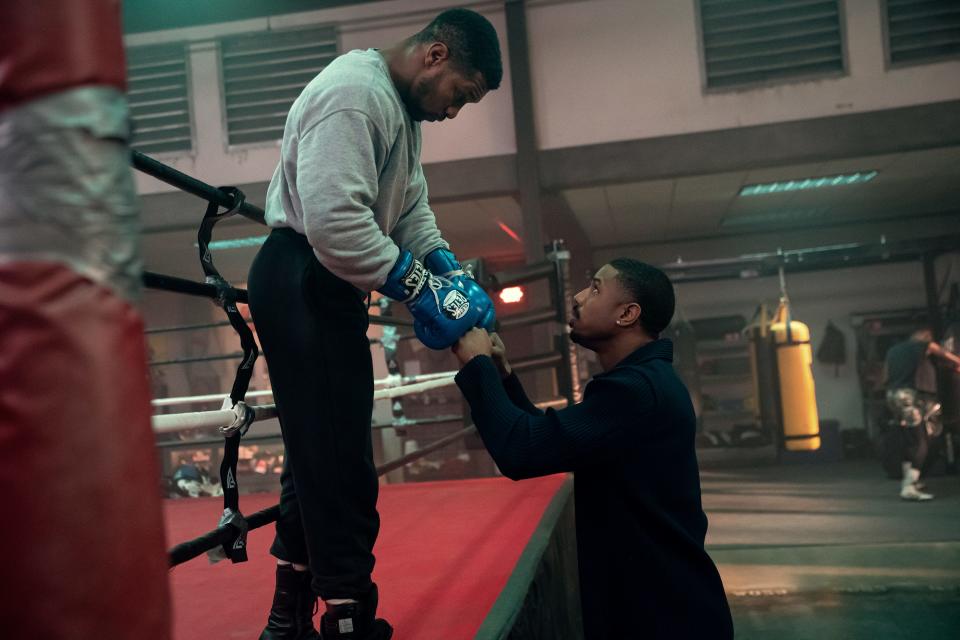 When he's released from jail, former boxing prodigy Damian Anderson (Jonathan Majors, left) asks childhood friend Adonis Creed (Michael B. Jordan) for help getting a title fight in "Creed III."