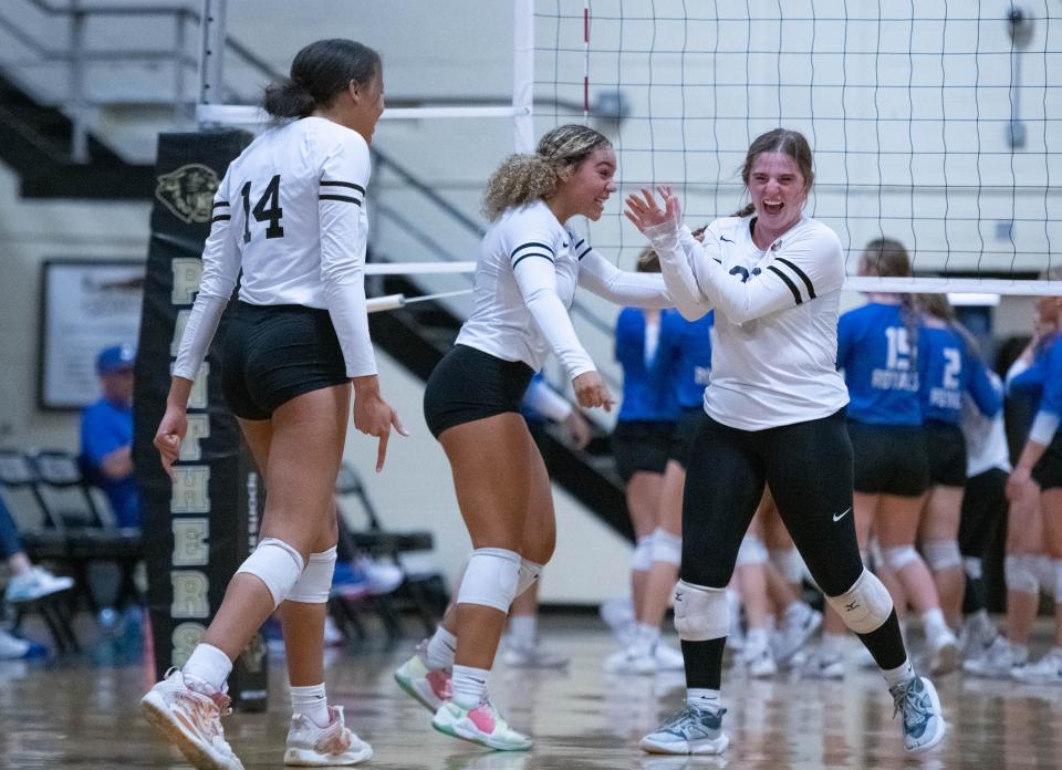 The Panthers celebrate winning the second set during the Jay vs Milton volleyball match at Milton High School on Thursday, Sept. 21, 2023.