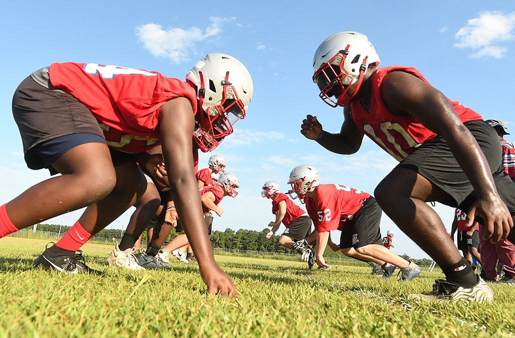 Pender runs through plays Tuesday Aug. 1, 2023 in Burgaw, N.C. High School football kicked off this week with coaches and players hitting the practice fields across the area. KEN BLEVINS/STARNEWS