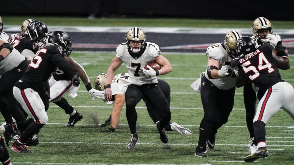 New Orleans Saints quarterback Taysom Hill (7) runs against the Atlanta Falcons during the second half of an NFL football game, Sunday, Dec. 6, 2020, in Atlanta. (AP Photo/Brynn Anderson)