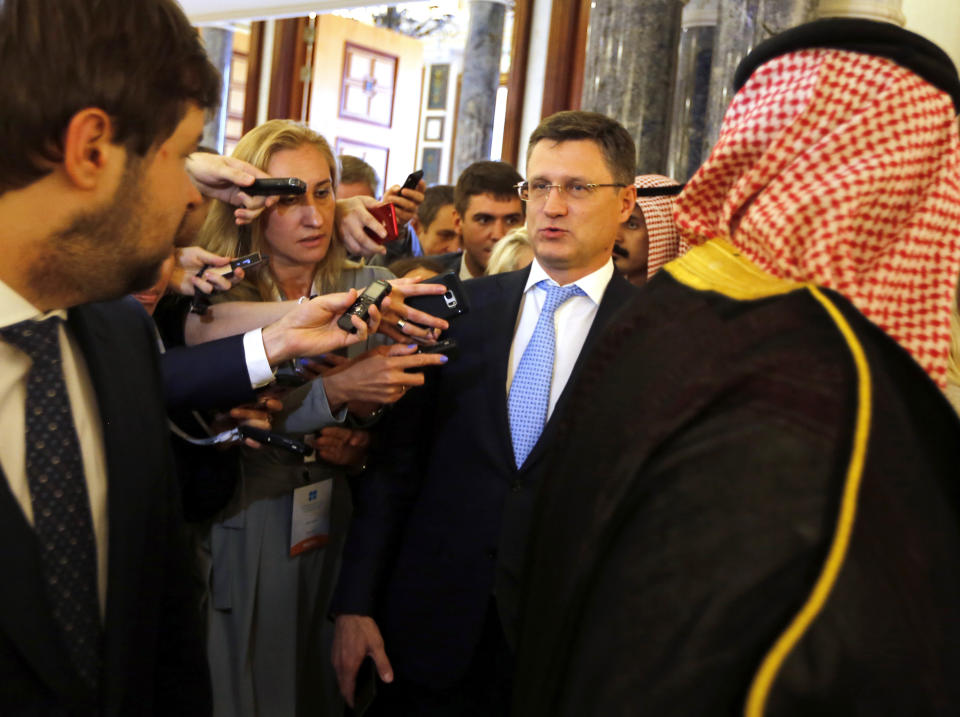 Russian Minister of Energy Alexander Novak is surrounded by reporters as he arrives to attend a meeting of the energy ministers from OPEC and its allies to discuss prices and production cuts, in Jiddah, Saudi Arabia, Sunday, May 19, 2019. The meeting takes places as tensions flare in the Persian Gulf after the U.S. ordered bombers and an aircraft carrier to the region over an unexplained threat they perceive from Iran, which comes a year after the U.S. unilaterally pulled out of Tehran's nuclear deal with world powers and reimposed sanctions on Iranian oil. (AP Photo/Amr Nabil)