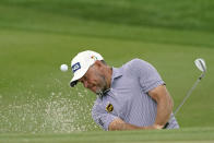 Lee Westwood, of England, hits a shot from a sand trap on the second hole during the third round of the Arnold Palmer Invitational golf tournament Saturday, March 6, 2021, in Orlando, Fla. (AP Photo/John Raoux)