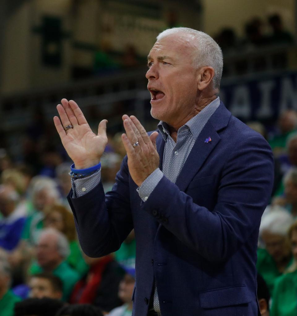 FGCU head coach Pat Chambers cheers on his players from the bench. The Florida Gulf Coast University men's basketball team defeated visiting Austin Peay 89-71 in their final game of the regular season Friday, Feb. 24, 2023.