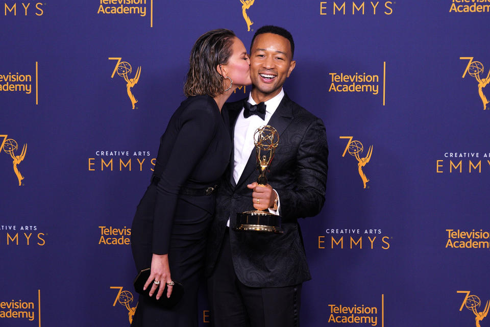Chrissy Teigen helped John Legend celebrate his Emmy win. (Photo: JC Olivera/Getty Images)