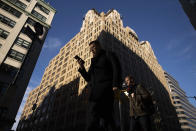 People walk by a building that has been chosen by Google as part of its expansion plans, Monday, Dec. 17, 2018, in New York. Google is spending more than $1 billion on a new campus along the Hudson River that will allow it to double the number of people it already employs here. (AP Photo/Mark Lennihan)