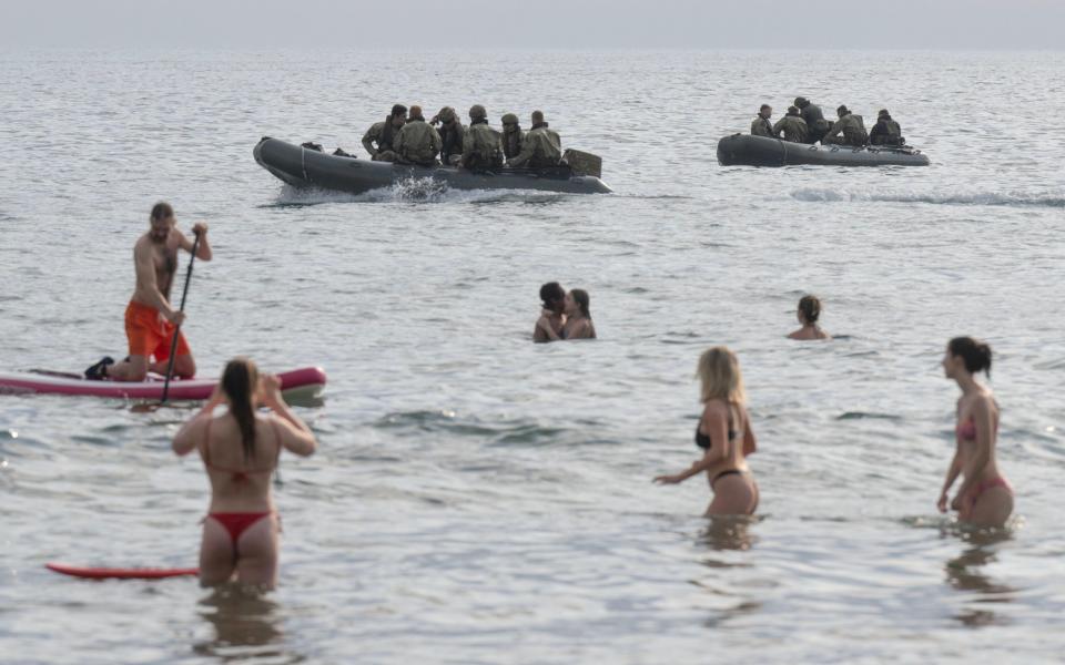 people enjoy the good weather while 47 Commando prepare for the D-Day reenactment