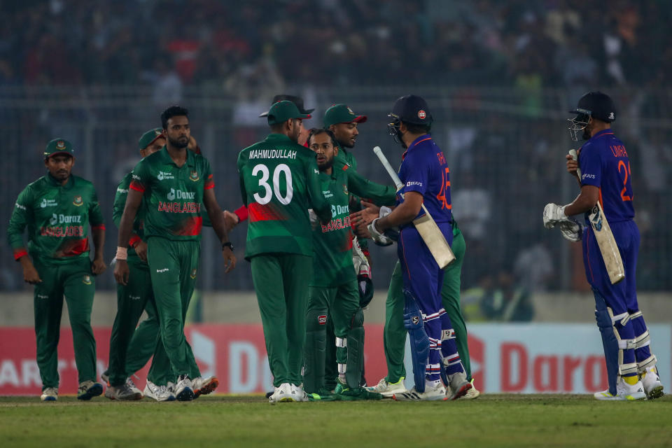 Indian captain Rohit Sharma, second right congratulates Bangladesh players who won the second one day international cricket match between Bangladesh and India in Dhaka, Bangladesh, Wednesday, Dec. 7, 2022. (AP Photo/Surjeet Yadav)