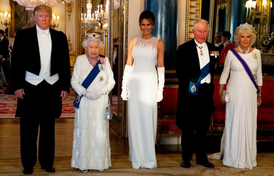 Britain's Queen Elizabeth II (2L), US President Donald Trump (L), US First Lady Melania Trump (C), Britain's Prince Charles, Prince of Wales (2R) and Britain's Camilla, Duchess of Cornwall pose for a photograph ahead of a State Banquet in the ballroom at Buckingham Palace in central London on June 3, 2019, on the first day of the US president and First Lady's three-day State Visit to the UK. - Britain rolled out the red carpet for US President Donald Trump on June 3 as he arrived in Britain for a state visit already overshadowed by his outspoken remarks on Brexit. (Photo by Doug Mills / POOL / AFP)        (Photo credit should read DOUG MILLS/AFP/Getty Images)