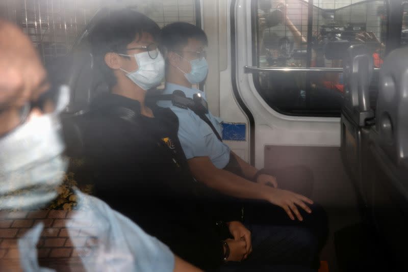 Former convenor of pro-independence group Studentlocalism, Tony Chung Hon-lam arrives at West Kowloon Magistrates‘ Courts in a police van after he was arrested under the national security law, in Hong Kong