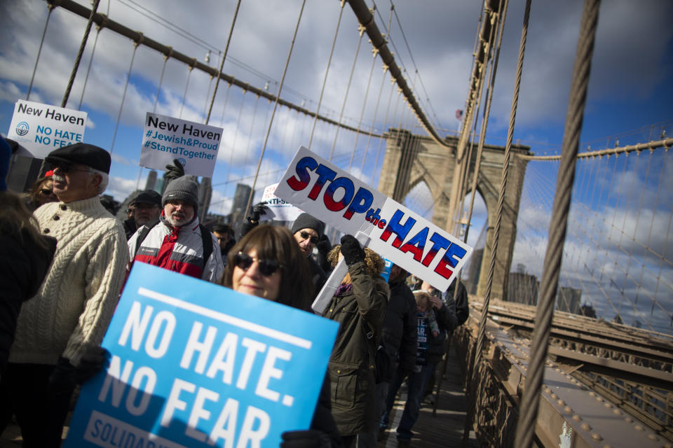 People take part in a march crossing the Brooklyn Bridge in solidarity with the Jewish community after recent string of anti-semitic attacks throughout the greater New York area, on Sunday, Jan. 5, 2020 in New York. (AP Photo/Eduardo Munoz Alvarez)