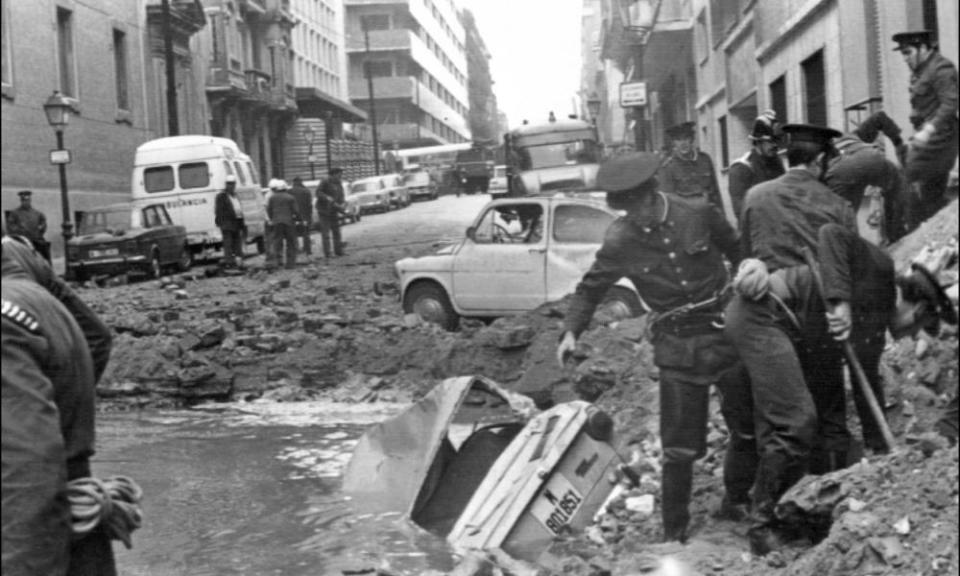 Police search debris after the 1973 bombing that killed the Spanish prime minister Luis Carrero Blanco.