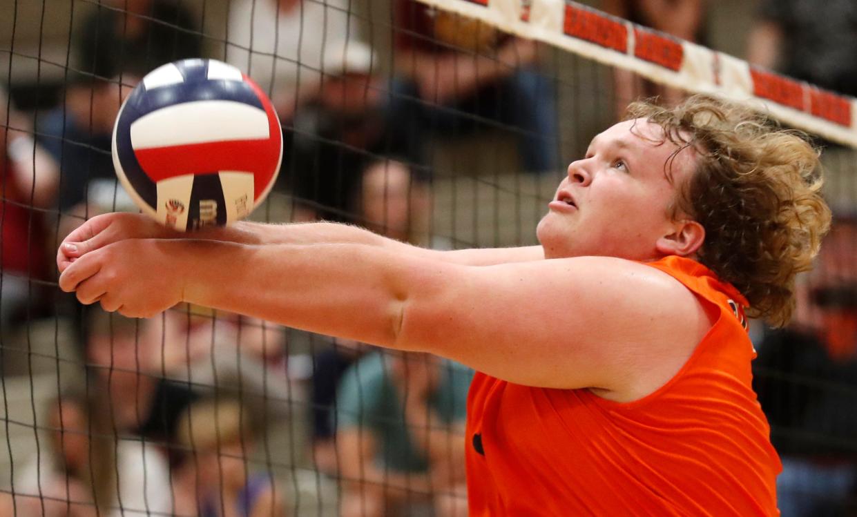 Harrison Raiders setter Conner Blevins (13) hits the ball during the IHSAA boys volleyball sectional championship against the McCutcheon Mavericks, Saturday, May 13, 2023, at Harrison High School in West Lafayette, Ind. Harrison won 3-1.