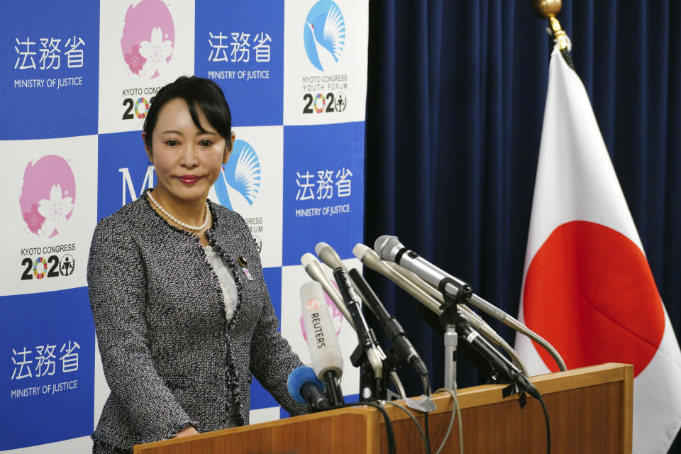 Japanese Justice Minister Masako Mori speaks about Nissan's former chairman Carlos Ghosn during a press conference at her ministry in Tokyo Thursday, Jan. 9, 2020. Mori is denouncing Ghosn's criticism of the nation's criminal justice system. Mori said she wanted to prevent his spreading an "erroneous" understanding abroad about Japan's system. Ghosn, who skipped bail while awaiting trial here, said in Beirut that Japan's system was unfair and rigged. (AP Photo/Eugene Hoshiko)