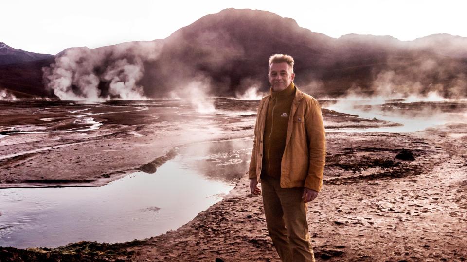 Chris Packham stands on El Tatio, one of the largest geyser fields in the world for the docuseries, Earth.