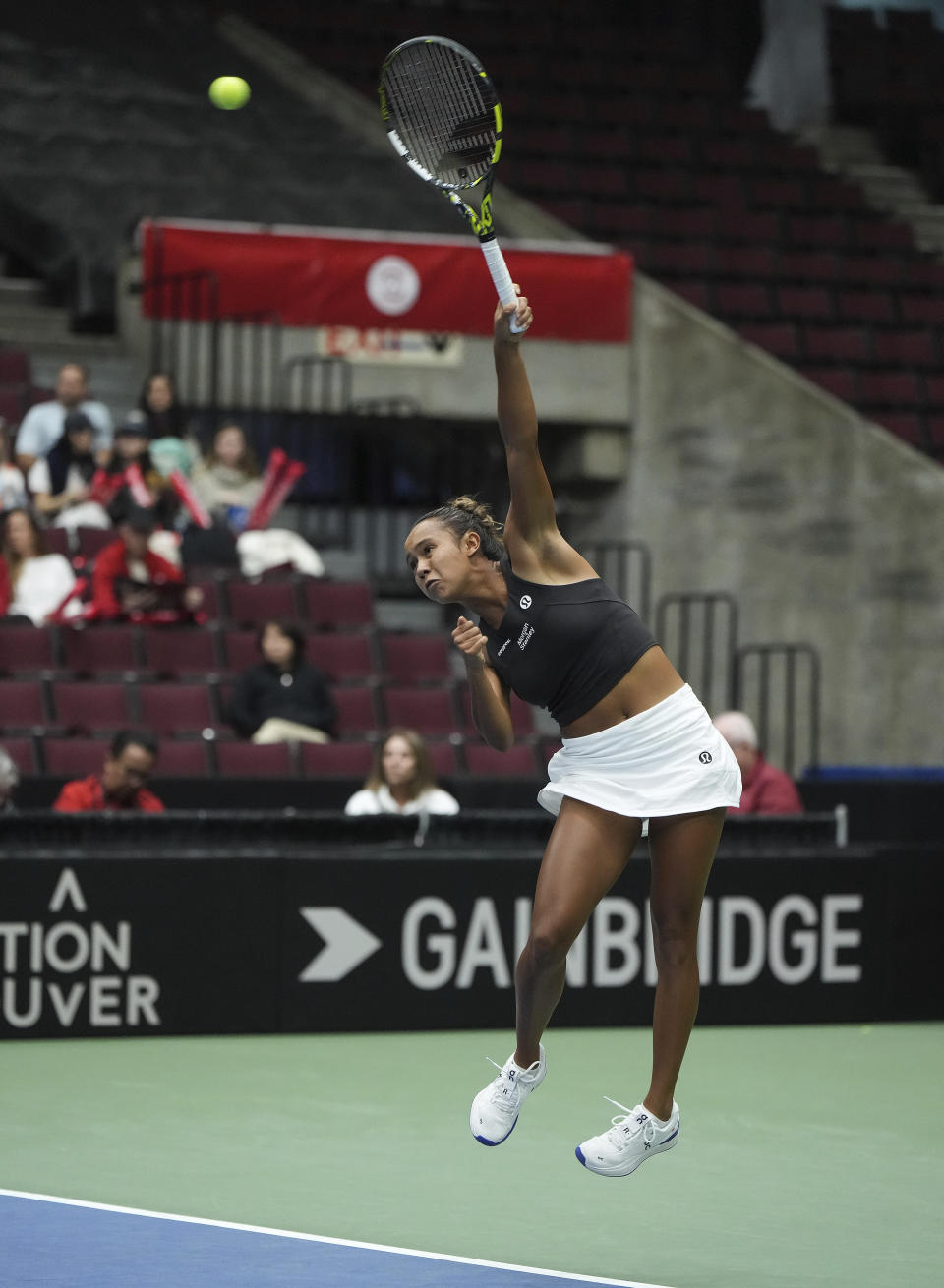 Canada's Leylah Fernandez serves to Belgium's Yanina Wickmayer during a Billie Jean King Cup tennis qualifier Friday, April 14, 2023, in Vancouver, British Columbia. (Darryl Dyck/The Canadian Press via AP)