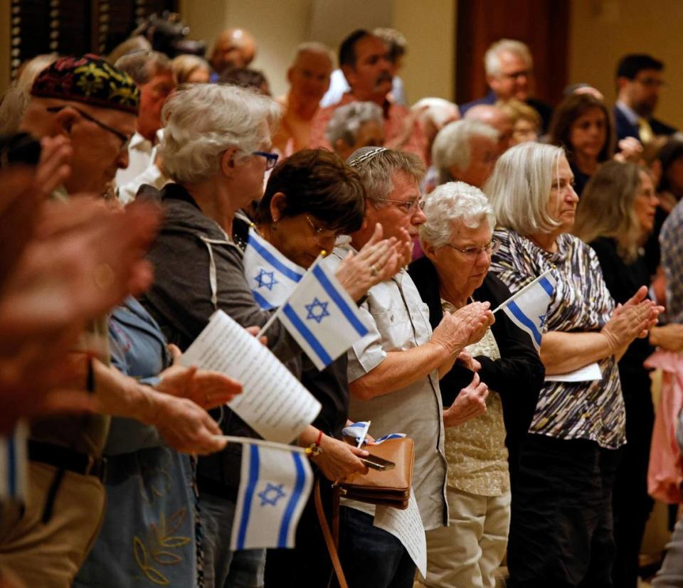 The congregation gives Mayor Mattie Parker a standing ovation when she says that Fort Worth stands with Israel during a vigil for Israel at Beth-El Congregation in Fort Worth, Texas, Tuesday, Oct. 10, 2023. City and faith leaders spoke to a full house for support of Israel. ( Bob Booth)