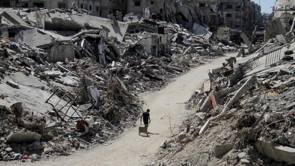 PHOTO: A Palestinian walks among the rubble of damaged buildings, which were destroyed during Israel's military offensive, amid the ongoing conflict between Israel and Hamas, in Beit Lahia in the northern Gaza Strip, June 12, 2024.  (Mahmoud Issa/Reuters)