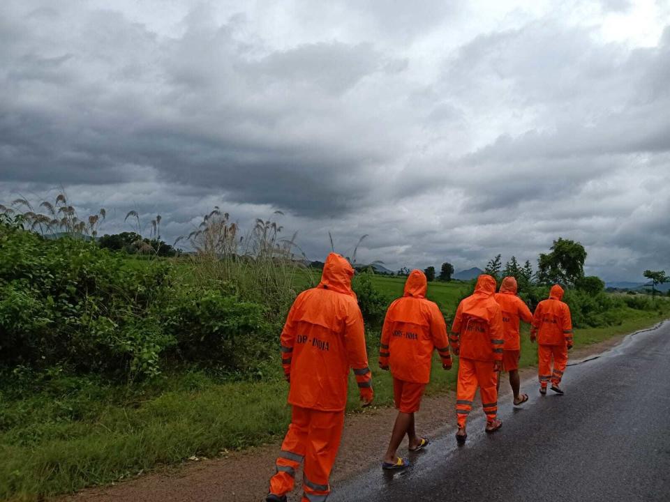 This Photograph provided by India's National Disaster Response Force (NDRF) shows NDRF personnel arriving in preparation for Cyclone Gulab, that likely to make landfall on Sunday evening at Ganjam, eastern Odisha state, India, Sunday, Sept.26, 2021. (National Disaster Response Force via AP)