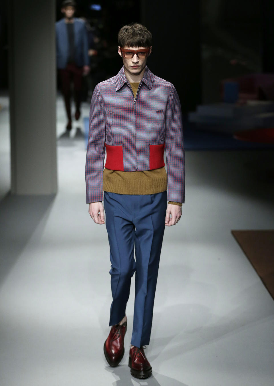 A model wears a creation for Prada men's Fall-Winter 2013-14 collection, part of the Milan Fashion Week, unveiled in Milan, Italy, Sunday, Jan. 13, 2013. (AP Photo/Antonio Calanni)