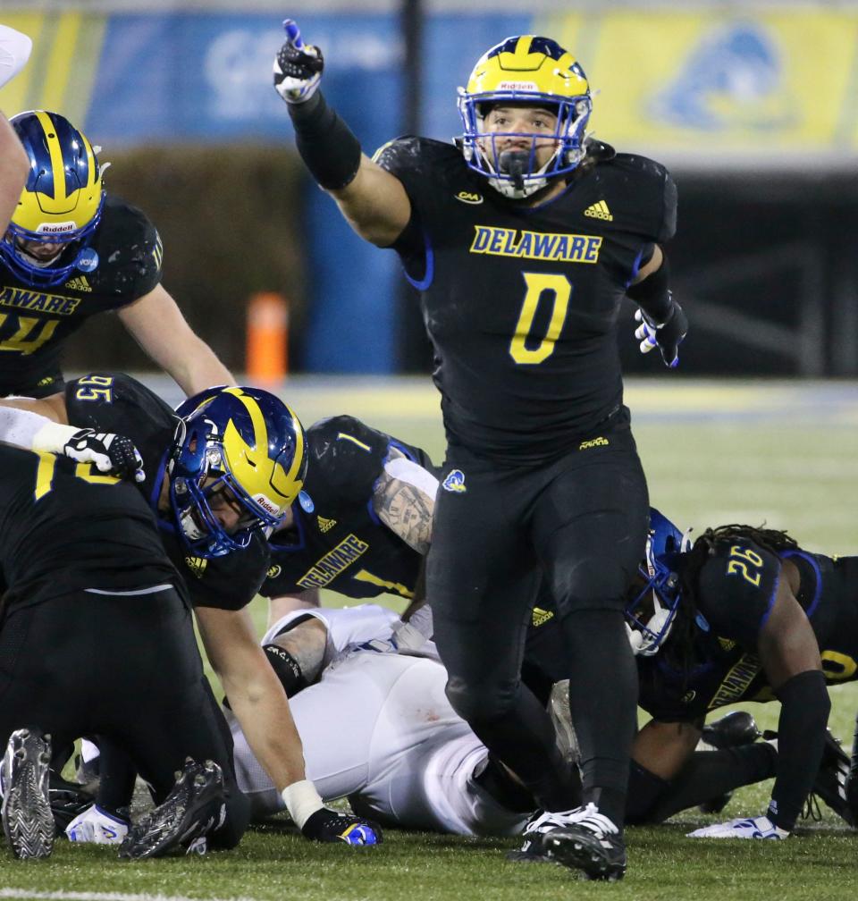Delaware's Jackson Taylor signals a change in possession after a Lafayette fumble in the fourth quarter of the Blue Hens' 36-34 win in the opening round of the NCAA FCS playoffs Saturday, Nov. 25, 2023 at Delaware Stadium.