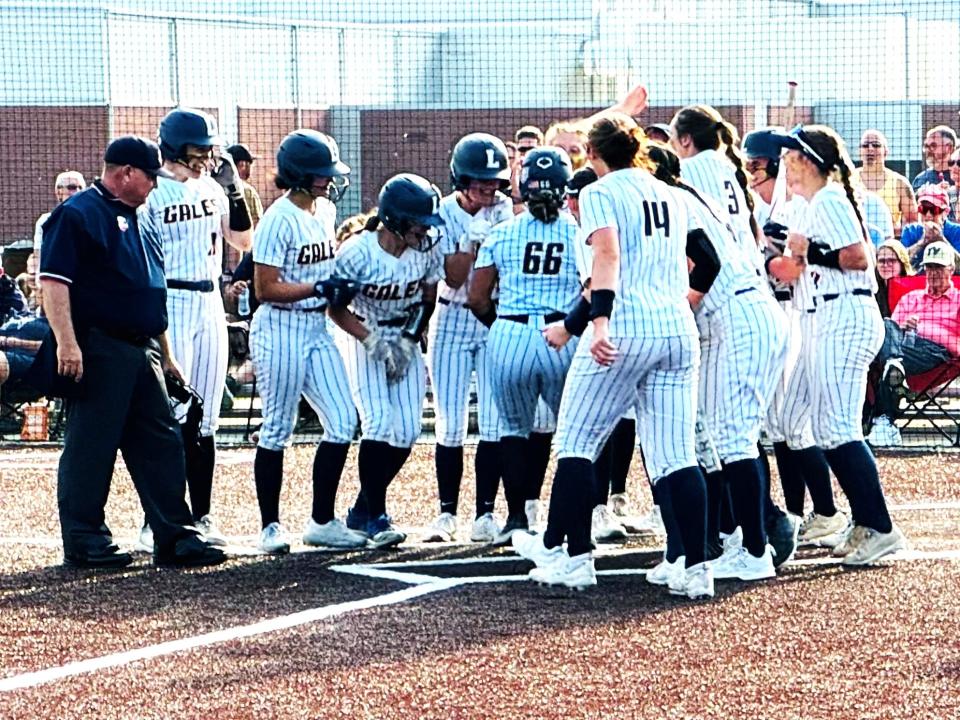 Lancaster senior Skylar Smith gets set to celebrate with her teammates after she hit a grand slam during the fourth inning of Wednesday's 10-0 Division I regional semifinal win over Teays Valley at Big Walnut High School.