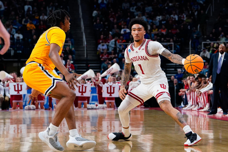 Indiana guard Jalen Hood-Schifino passes the ball as Kent State guard Malique Jacobs defends during a game last month. (Gregory Fisher/USA TODAY Sports)