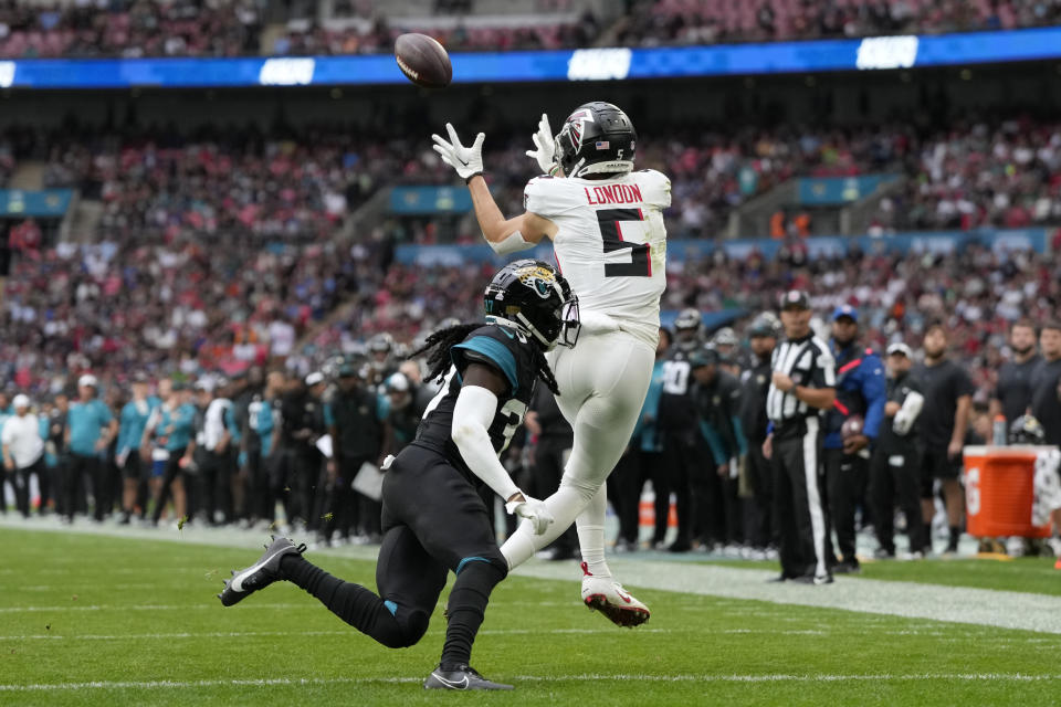 Atlanta Falcons wide receiver Drake London (5) catches the ball to scored a touchdown during the third quarter of an NFL football game between the Atlanta Falcons and the Jacksonville Jaguars at Wembley stadium in London, Sunday, Oct. 1, 2023. (AP Photo/Kirsty Wigglesworth)