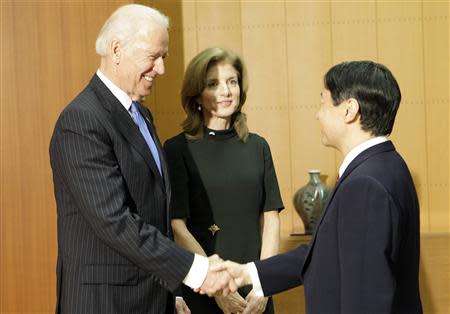 U.S. Vice President Joe Biden (L), accompanied by U.S. Ambassador to Japan Caroline Kennedy, is greeted by Japan's Crown Prince Naruhito upon his arrival at the Togu Palace in Tokyo November 3, 2013. REUTERS/Junji Kurokawa/Pool