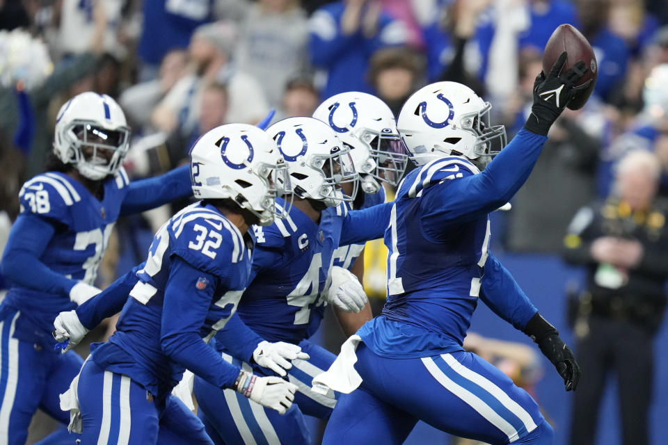 Indianapolis Colts' Kwity Paye (51) celebrates a fumble recovery during the second half of an NFL football game against the Los Angeles Chargers, Monday, Dec. 26, 2022, in Indianapolis. (AP Photo/Michael Conroy)