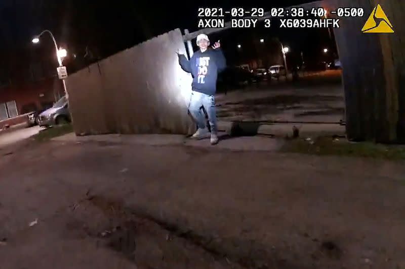 Adam Toledo, 13, holds up his hands a split second before he was shot by police