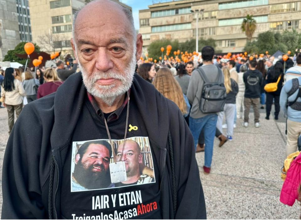 Itzik Horn, the father of hostages Iair and Eitan, who are pictured on his T-shirt.